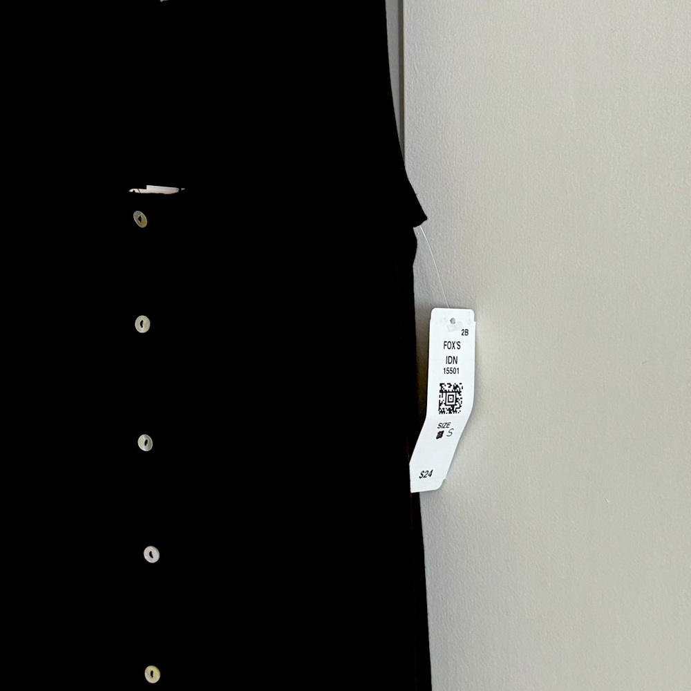 New sleeveless black top with tan buttons